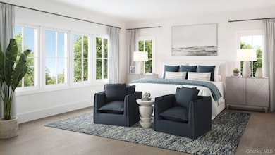 Bedroom with baseboards and wood finished floors