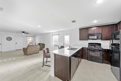 Kitchen with ceiling fan, sink, kitchen peninsula,