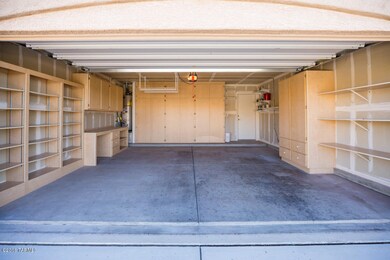 2 car garage with abundace of shelves an