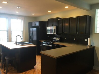 View from living room of the spacious modern kitch