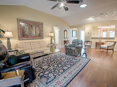 LOVELY, WIDE-PLANK laminate flooring in the living