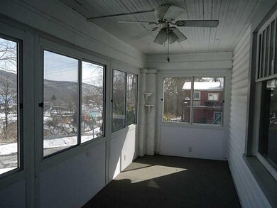 Sunroom. 21x6 front porch with great view.
