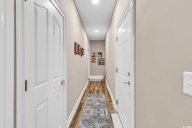 Corridor featuring recessed lighting and light wood-style floors