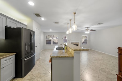 Another view of the kitchen highlights the invitin