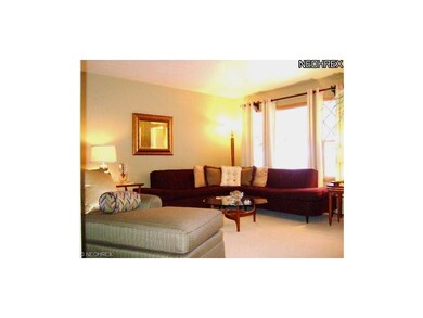 The spacious living room boasts beautiful neutral 