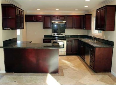 Features includes granite slab counter tops, trave