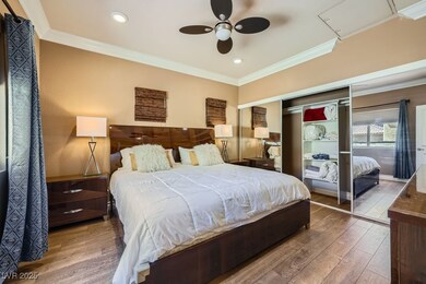Primary Bedroom with Mirrored Doors & Ceiling Fan
