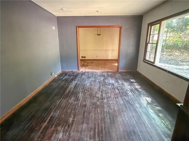 Spare room featuring visible vents, baseboards, an