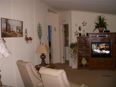 Another view of formal living room this room offers up to date paint and nice floor covering.