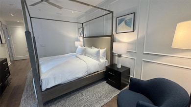 Bedroom featuring wood finished floors, a ceiling fan, and recessed lighting