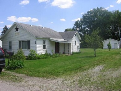 Exterior View of House and Detached Gara