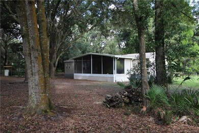 Rear of home with large screened porch
