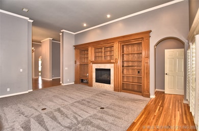 Living room with gas fireplace and built-ins