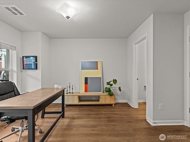 Ground level open room is perfect for a home office or flex space.