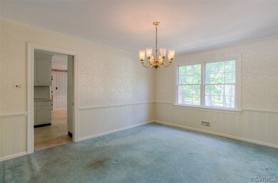 Dining room, hardwood floors underneath the carpet