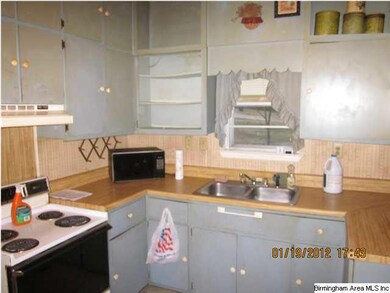 Kitchen has built in cabinets.
