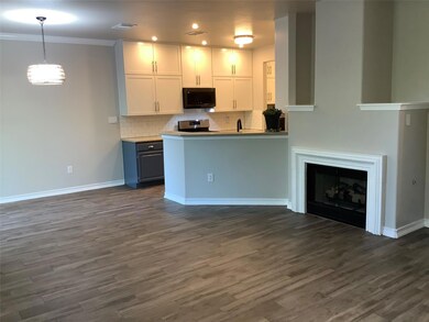 Kitchen featuring dark wood-style flooring, white