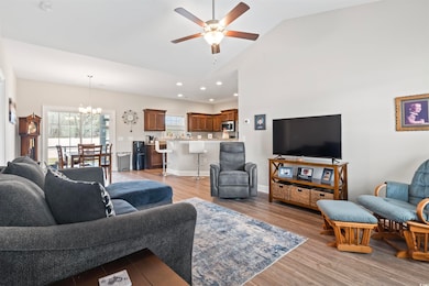 Living room featuring high vaulted ceiling, ceilin