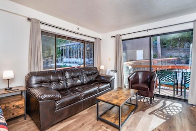 Great room is enhanced by large side window, as we
