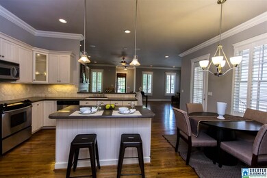 Kitchen includes an eat-in breakfast area, island,