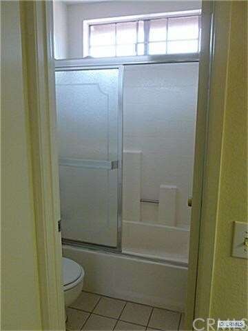 Full bath with tiled floors