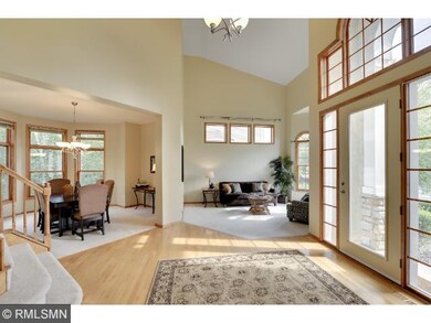 Grand foyer with loads of natural light, open conc