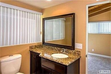 Remodeled attached bath with travertine shower and