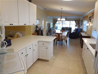 Kitchen with kitchen peninsula, light tile pattern