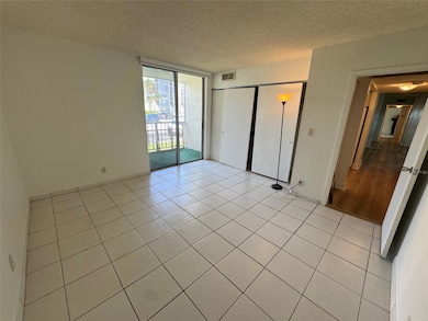 Large primary Bedroom with balcony