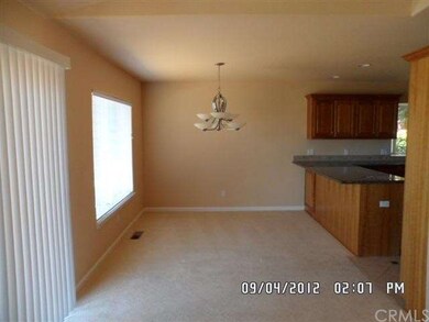 Dining area next to kitchen, w/slider to rear uppe