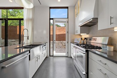 Kitchen with extractor fan, stainless steel appli