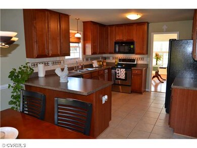Kitchen - 42 inch cabinets, tile flooring, tile ba