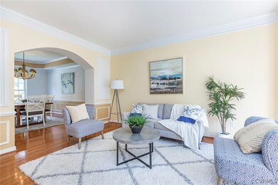 Living room featuring a chandelier, hardwood / woo