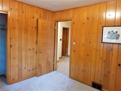 Bedroom 3 with paneling, a large closet, plus new 