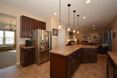 The kitchen has beautiful stainless steel applianc