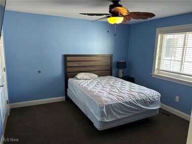 Bedroom featuring visible vents, baseboards, and ceiling fan