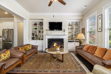 Step inside to find Soaring Ceilings, Gleaming Hardwood Floors, Elegant Crown Molding, and Beautifully Arched Doorways that set the tone for the refined interiors