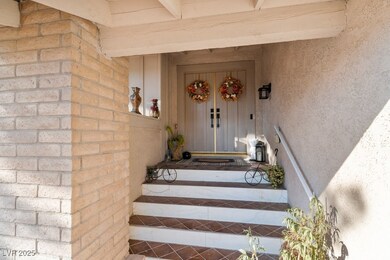 Property entrance featuring stucco siding