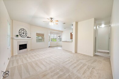 Welcome in!  Spacious den with fireplace open to kitchen & dining.