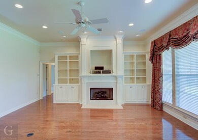 Beautiful hardwood floors and fireplace with built