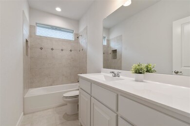 Secondary bathroom features full shower/tub with c