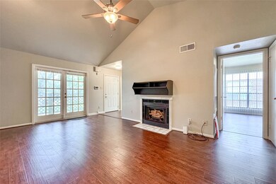 Living and dining area with vaulted ceiling