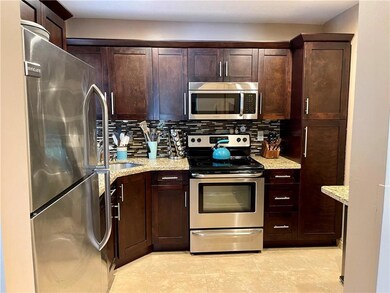 Wood cabinets, granite counters, stainless steel a