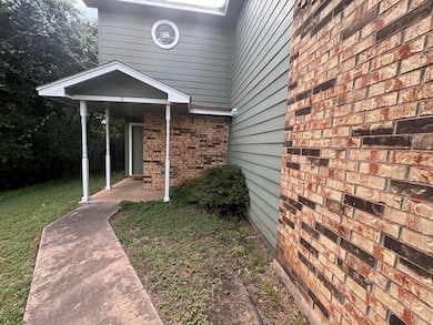 View of property exterior with a patio area, a la