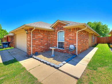 Single story home featuring a front lawn, brick si