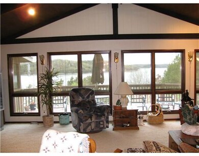 Living Room. Wall of glass in livingroom looking o