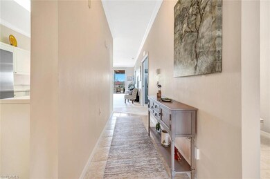 Corridor with ornamental molding and baseboards
