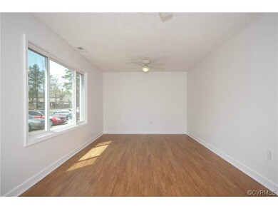 Another view of the living room with lots of natural bright light.