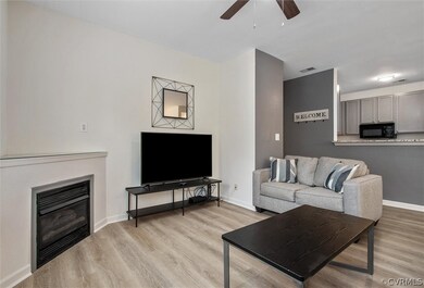 Family room view to foyer/entry and kitchen