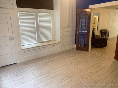 Unfurnished room with wood finished floors